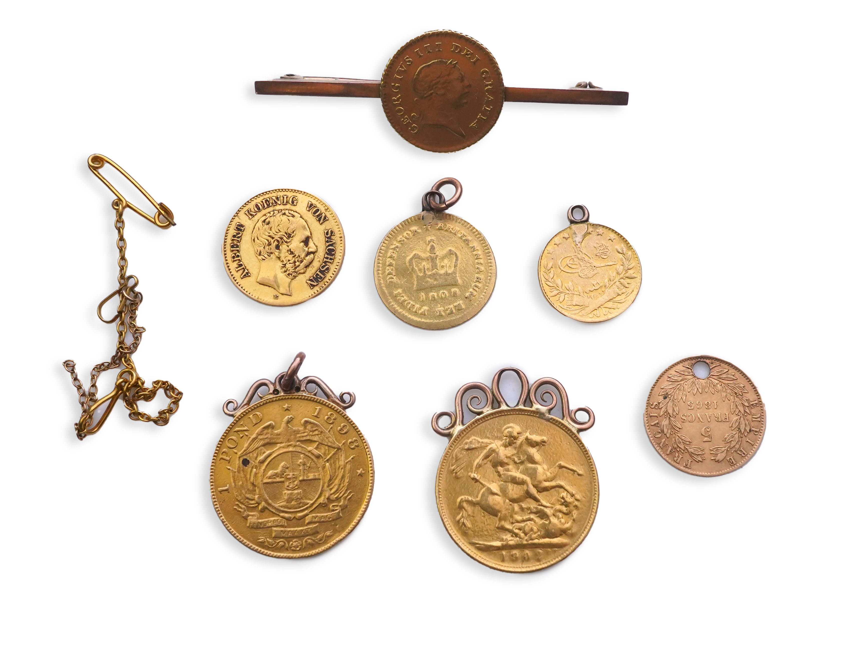 Seven assorted mounted or drilled gold coins